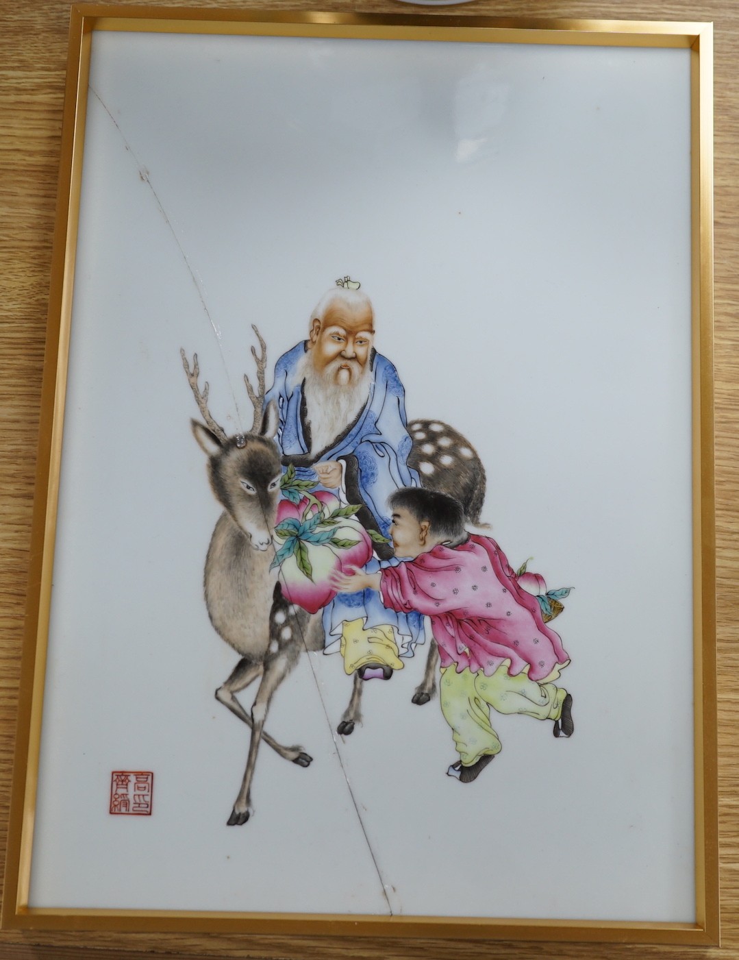 A framed Chinese famille rose plaque (a.f.) 39 x 28cm including frame